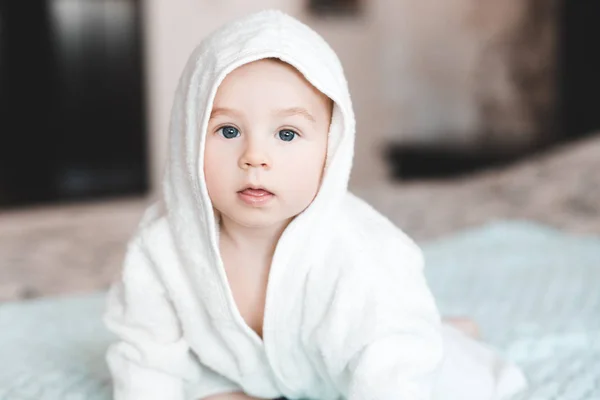 Cute Baby Sitting Bed White Towel Closeup Looking Camera Childhood — Stock Photo, Image