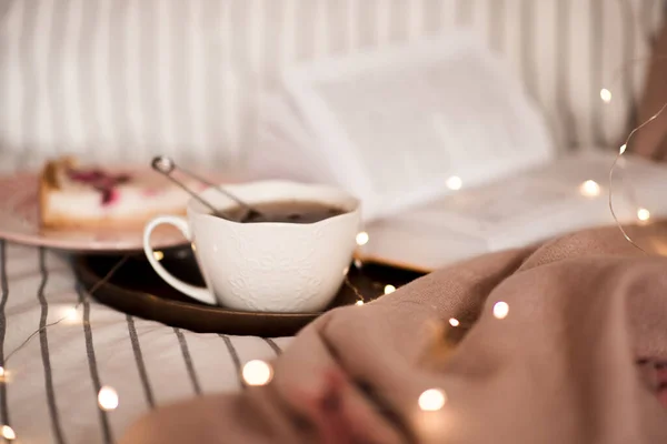 Cup Black Tea Open Book Lights Background Bed Closeup Good — Stock Photo, Image