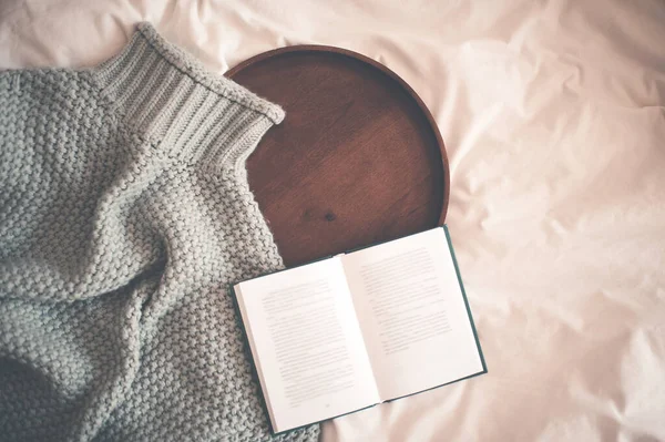 Open Book Knitted Sweater Wooden Tray Bed Closeup Winter Season Royalty Free Stock Images