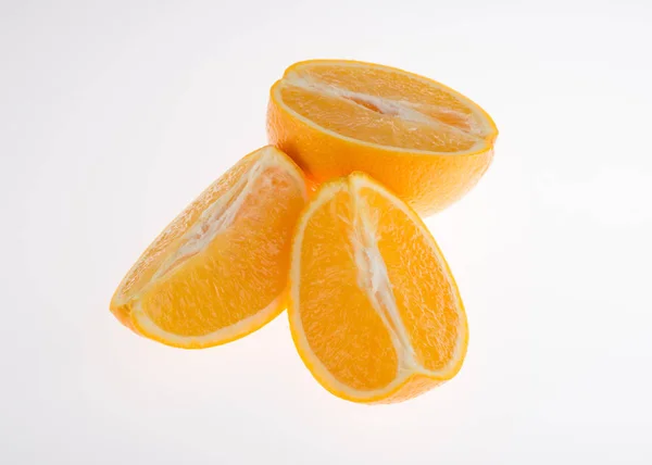 Fresh orange and cut in half on white background — Stock Photo, Image
