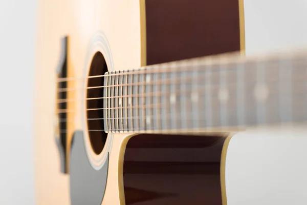 Acoustic guitar bridge and strings with selective focus