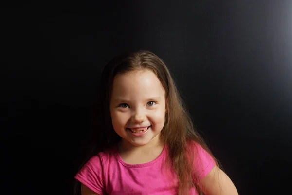 Portrait of a happy smiling small girl with lost baby teeth — Stock Photo, Image