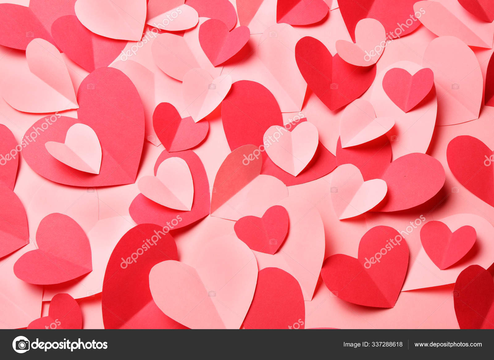 Bunch of cut out of pink and red paper hearts on pink background Stock  Photo by ©AlexeyRyumin 337288618