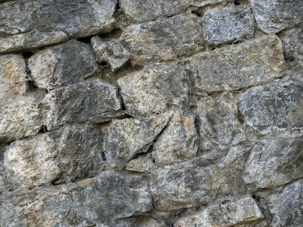 Ortaçağ Dan Kalma Yıpranmış Taşların Çapraz Arka Planı Bir Duvar — Stok fotoğraf