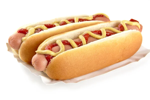 Americké hotdogy s hořčicí izolované na tácu Stock Fotografie