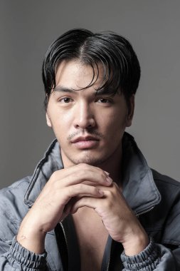Portrait of Asian man in the jacket - Head shot clipart
