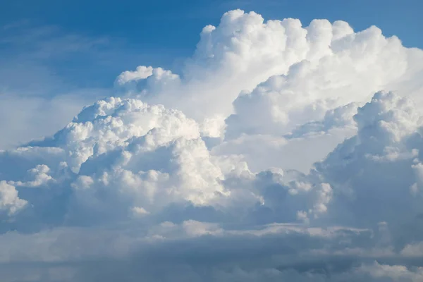 Aerial view from the plane of fluffy rain cloud in daytime - Cloudscape — Stock Photo, Image