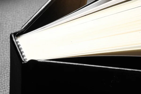 Hardcover book in black background — Stock Photo, Image