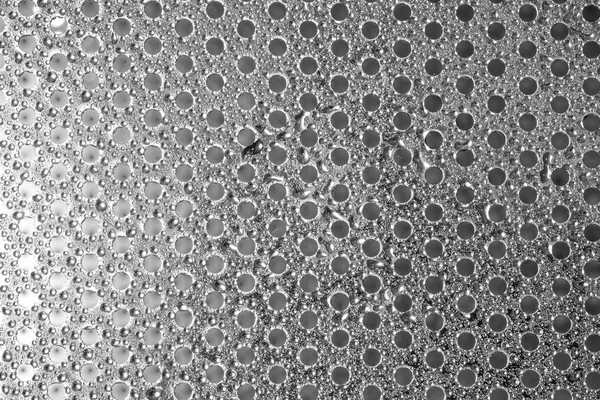 metal dairesel delik plaka ve çiğ damla doku