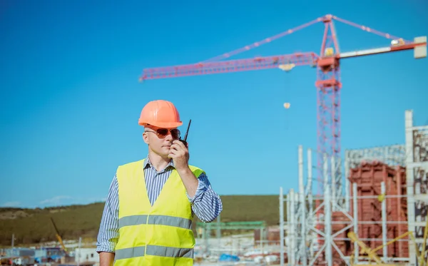 Portrait of a male engineer on a construction site background — Stock Photo, Image