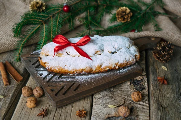 Christmas stollen on board with decorations. — Stock Photo, Image