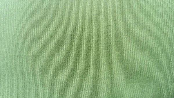 Bahan tenun hijau muda kasar, mirip dengan kanvas, linen atau kapas tebal. Kain tebal untuk pelapis, untuk seprai dan penutup — Stok Foto