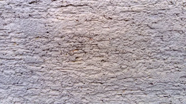 Camada de acabamento formada por argamassa endurecida. Parede leve rebocada. Textura de cimento de espátula — Fotografia de Stock