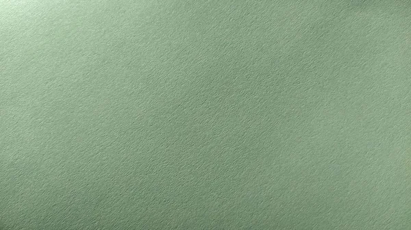 Uma folha de papel verde claro com vinheta na parte inferior. Verde calmo com textura de papel fino. Cor interior calmante — Fotografia de Stock