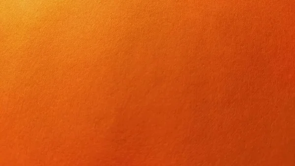 Uma folha de papel grosso de cor laranja brilhante. Close-up. Fundo sombra intensa. Iluminação lateral natural. Textura fina de papelão ou papel. Gradiente de luz em grau de iluminação — Fotografia de Stock