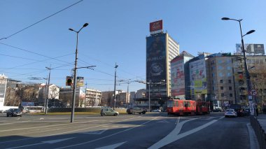 Belgrade / Serbia - January 24, 2020: Slavia Square in the center of Belgrade. Roundabout. Active traffic, cars, public transport, lights, road markings. Hotel Slavia and modern buildings