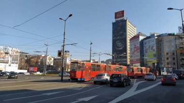 Belgrade, Serbia - January 24, 2020: Slavia Square in the center of Belgrade. Roundabout. Active traffic, cars, public transport, lights, road markings and tram. Hotel Slavia and modern buildings.
