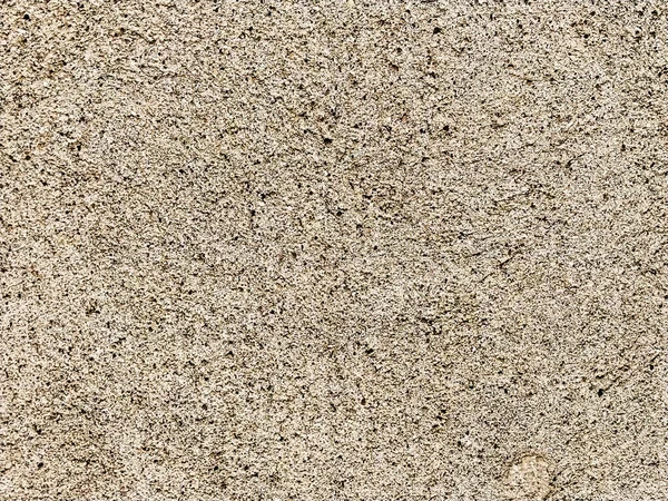 Betonoberfläche mit bunten Flecken aus kleinen Steinen. Li — Stockfoto