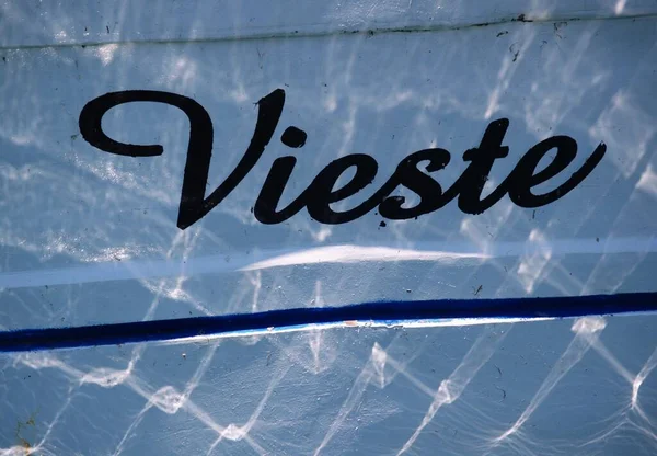 detail of Vieste name written on boat, name of popular italian little town summer resort with beaches in Gargano region