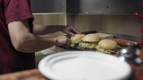 Chef Cutting Half Some Burgers Hot Plate — Stock Video
