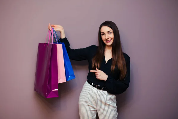 Beautiful Young Woman Showing Finger Shopping Bags — Stock Photo, Image