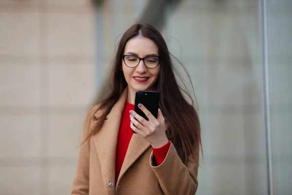 girl in a coat with a suitcase going to the landing zone.