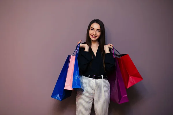 Beautiful Young Woman Colored Shopping Bags Purple Background — Stock Photo, Image