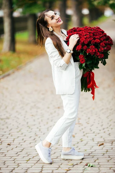 Beautiful Girl Suit Flowers Hands Rose Green Background — Stock Photo, Image