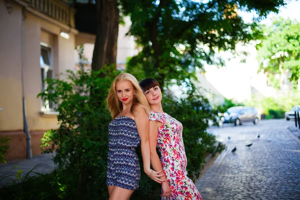 Two young girls hug and laugh. lviv — Stock Photo, Image