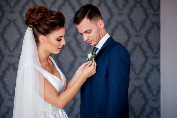 Amazing smiling wedding couple. Pretty bride and stylish groom