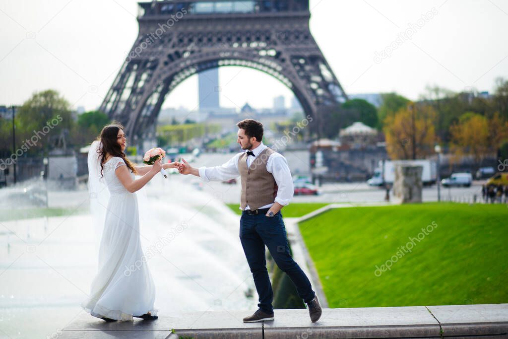 wedding couple. The bride in a beautiful wedding dress, the bride in a stylish tuxedo, Paris France