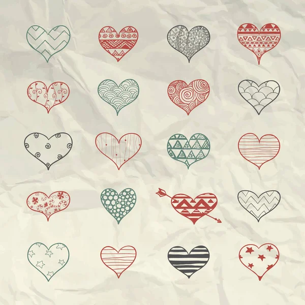 Vector dibujado a mano formas del corazón con patrones de Doodle — Vector de stock