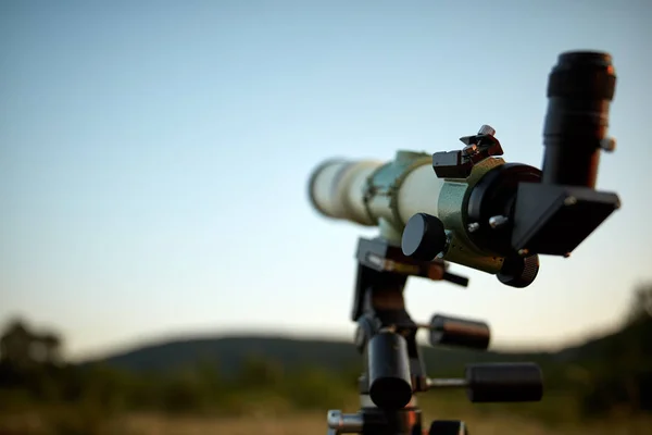 Telescope for observing the universe on a meadow outdoors. — Stock Photo, Image