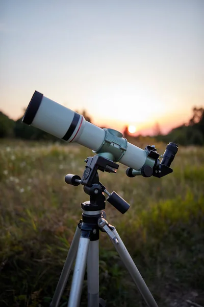 Telescope for observing the universe on a meadow outdoors. — Stock Photo, Image