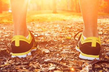 Man with jogging sneakers / shoes in the park.