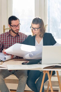 Team made of young architects in the sunny office.