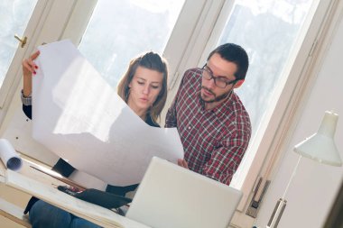 Team made of young architects in the sunny office.