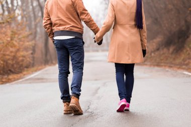 Couple enjoying outdoors in cold autumn / winter time.