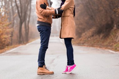 Couple enjoying outdoors in cold autumn / winter time.