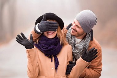 Couple enjoying outdoors in cold autumn / winter time.