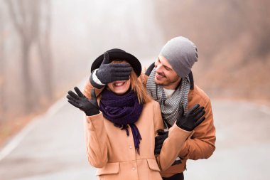 Couple enjoying outdoors in cold autumn / winter time.