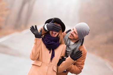 Couple enjoying outdoors in cold autumn / winter time.