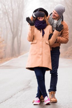 Couple enjoying outdoors in cold autumn / winter time.