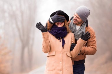 Couple enjoying outdoors in cold autumn / winter time.