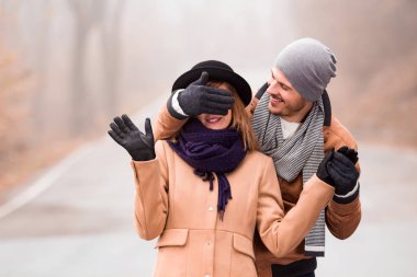 Couple enjoying outdoors in cold autumn / winter time.