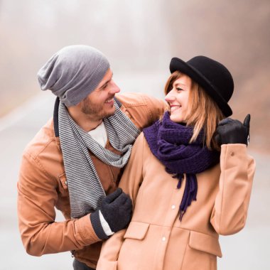 Couple enjoying outdoors in cold autumn / winter time.
