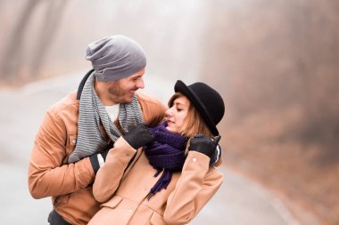 Couple enjoying outdoors in cold autumn / winter time.