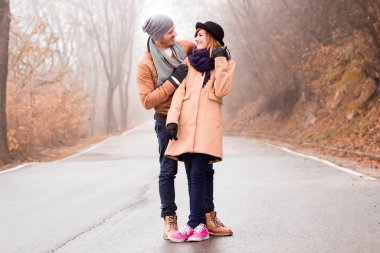 Couple enjoying outdoors in cold autumn / winter time.