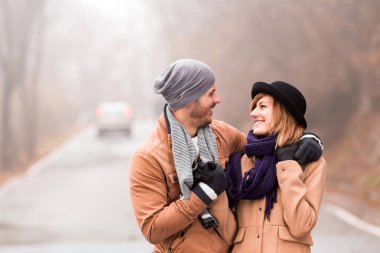 Couple enjoying outdoors in cold autumn / winter time.