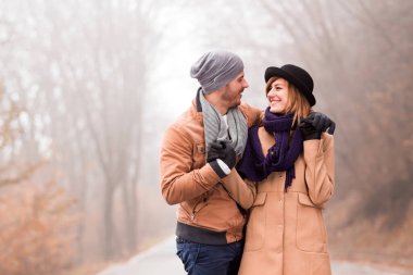 Couple enjoying outdoors in cold autumn / winter time.